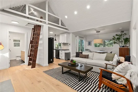 a living room with furniture and a rug