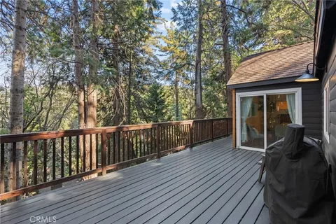 a view of deck with wooden floor and outdoor seating