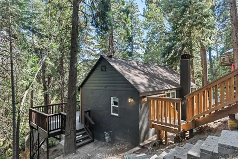 a view of a roof deck with wooden fence and floor