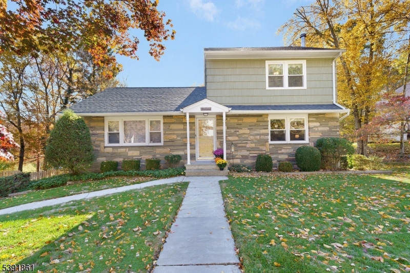 a front view of a house with yard