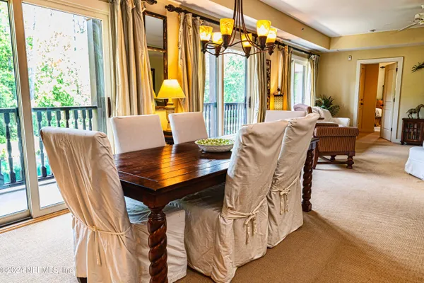 a view of a dining room with furniture and window