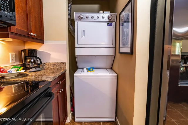 a kitchen with a refrigerator and a stove