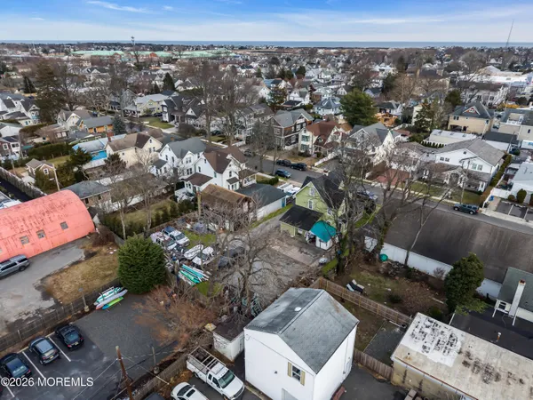 an aerial view of a house with a yard and fountain