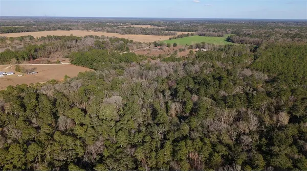 an aerial view of a house with a outdoor space