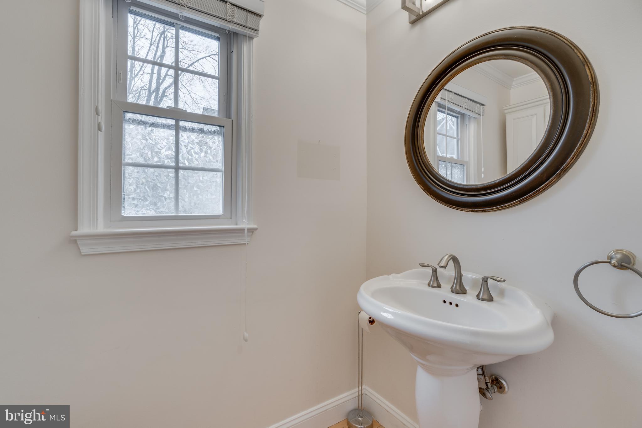 2069 Cobblestone Lane Reston, VA 20191 - Photo 32 of 35 a bathroom with a sink and a mirror