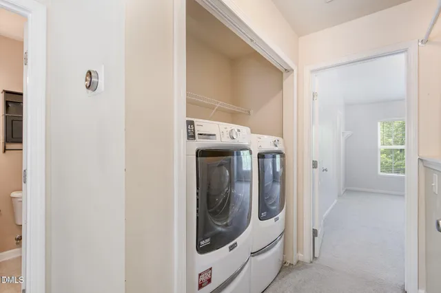 a utility room with window washer and dryer