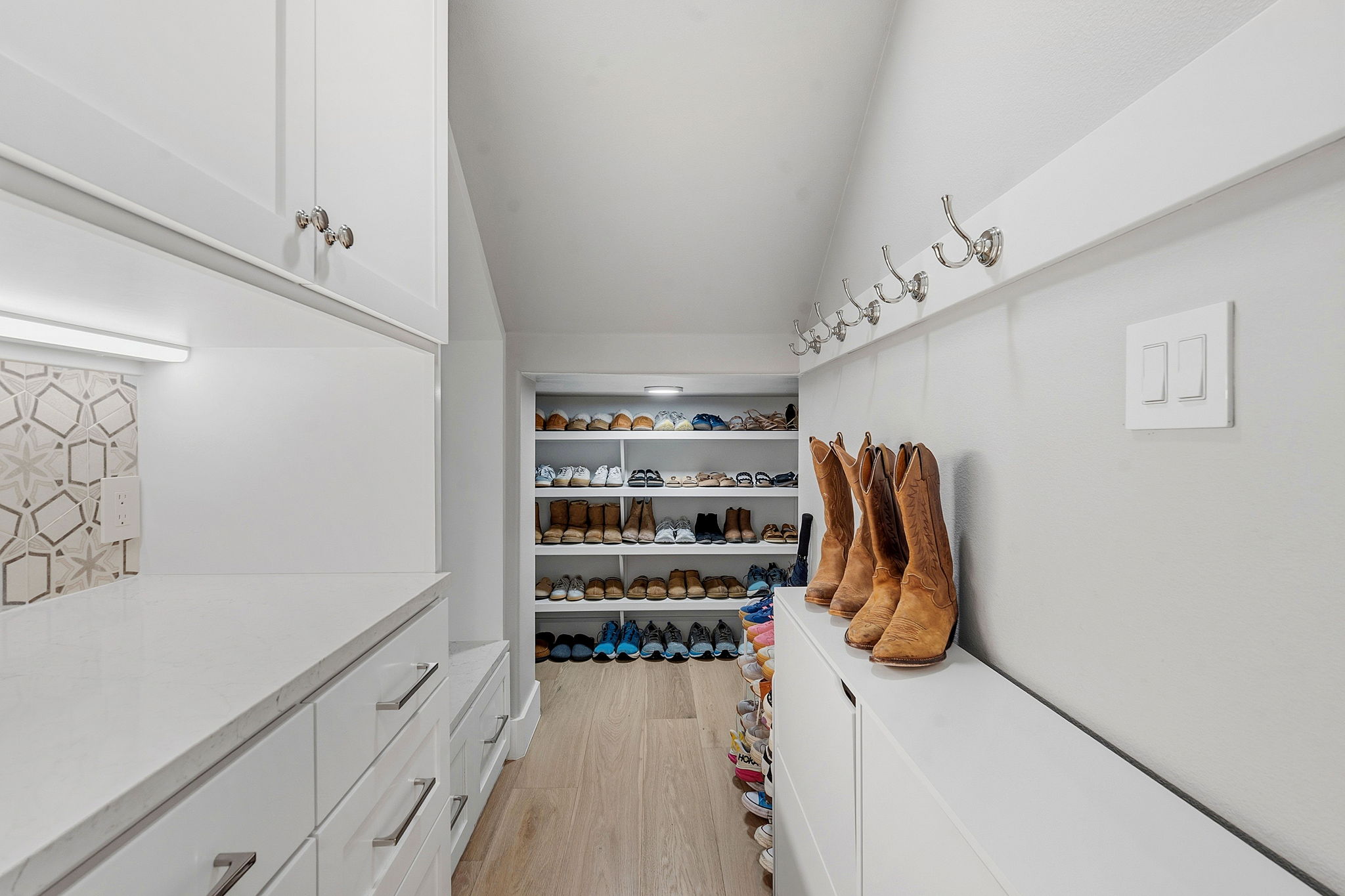 11501 Turtle Lane Austin, TX 78726 - Photo 17 of 37 a view of walk in closet with clothes and shoes