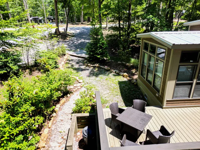 a view of backyard with outdoor seating and green space