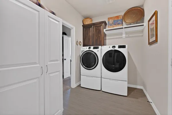 a utility room with dryer and washer