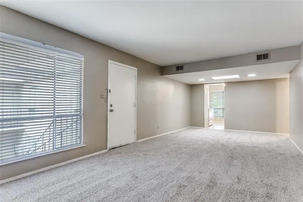 an empty room with a bathroom