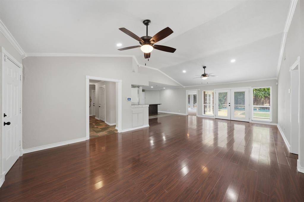 1108 Billie Ruth Lane Hurst, TX 76053 - Photo 5 of 27 Spacious interior featuring wood-finish flooring, vaulted ceilings, and recessed lighting