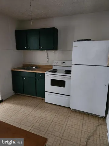 a kitchen with a cabinets and a stainless steel appliances