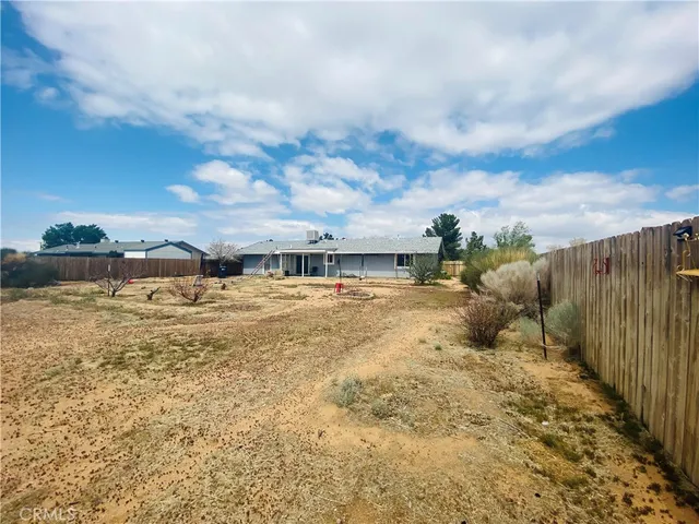 a view of a terrace with wooden fence