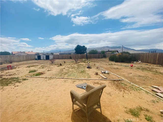 a view of swimming pool with an outdoor seating