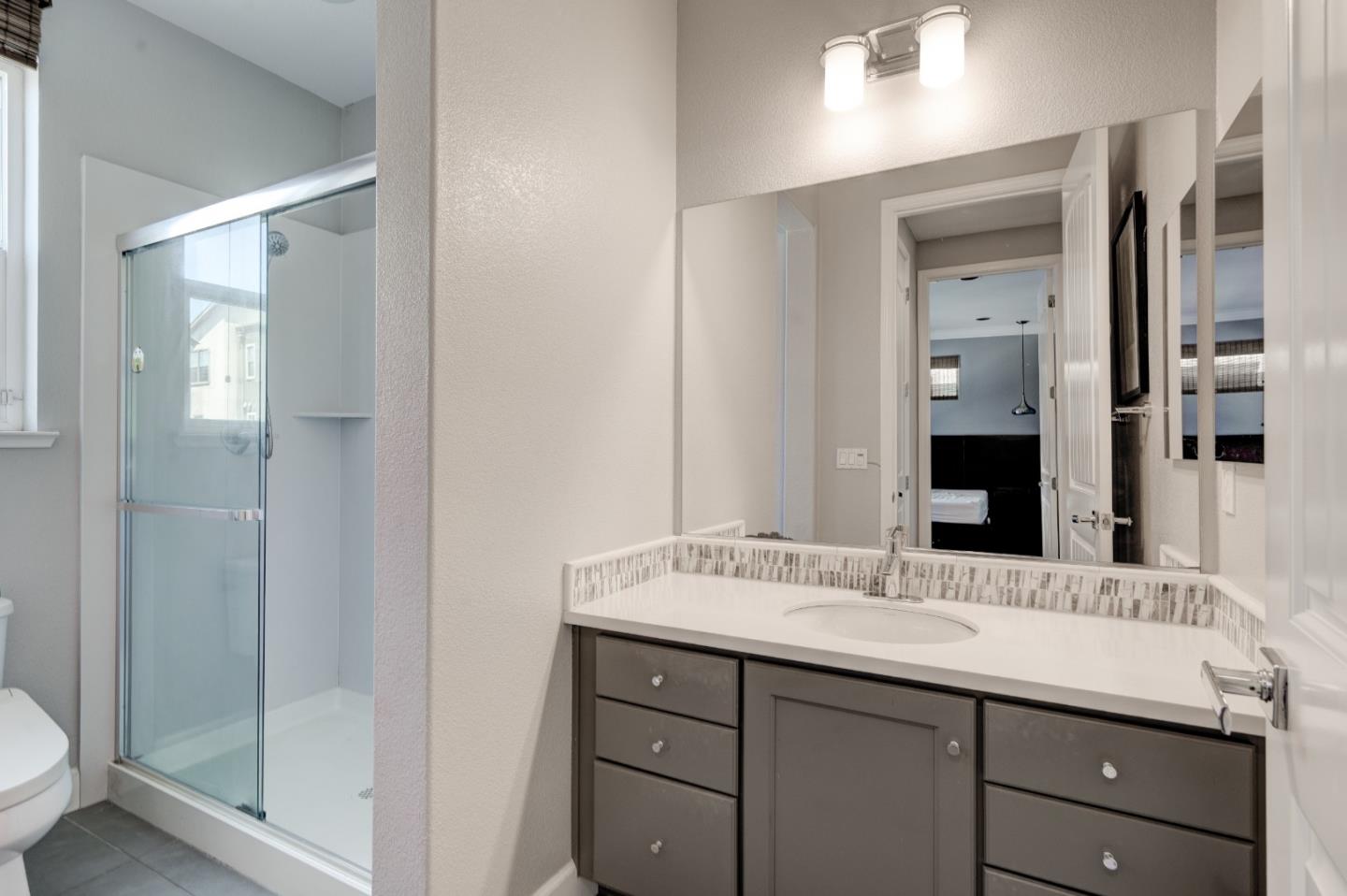 2006 Jubilee Drive Hayward, CA 94541 - Photo 32 of 73 a bathroom with a granite countertop sink mirror and double