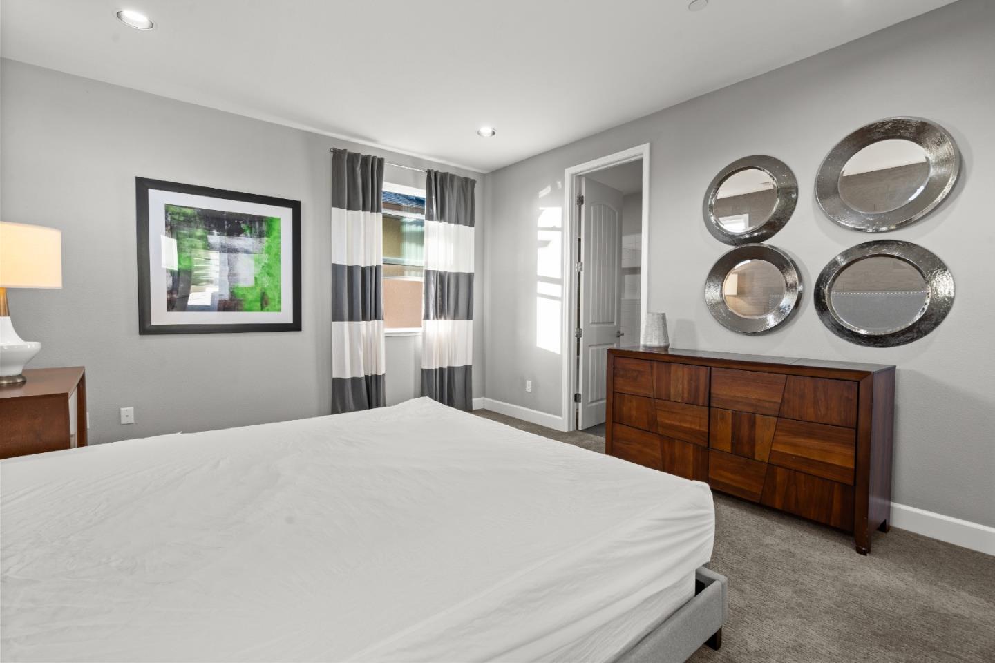 2006 Jubilee Drive Hayward, CA 94541 - Photo 38 of 73 a bedroom with a bed and a chandelier