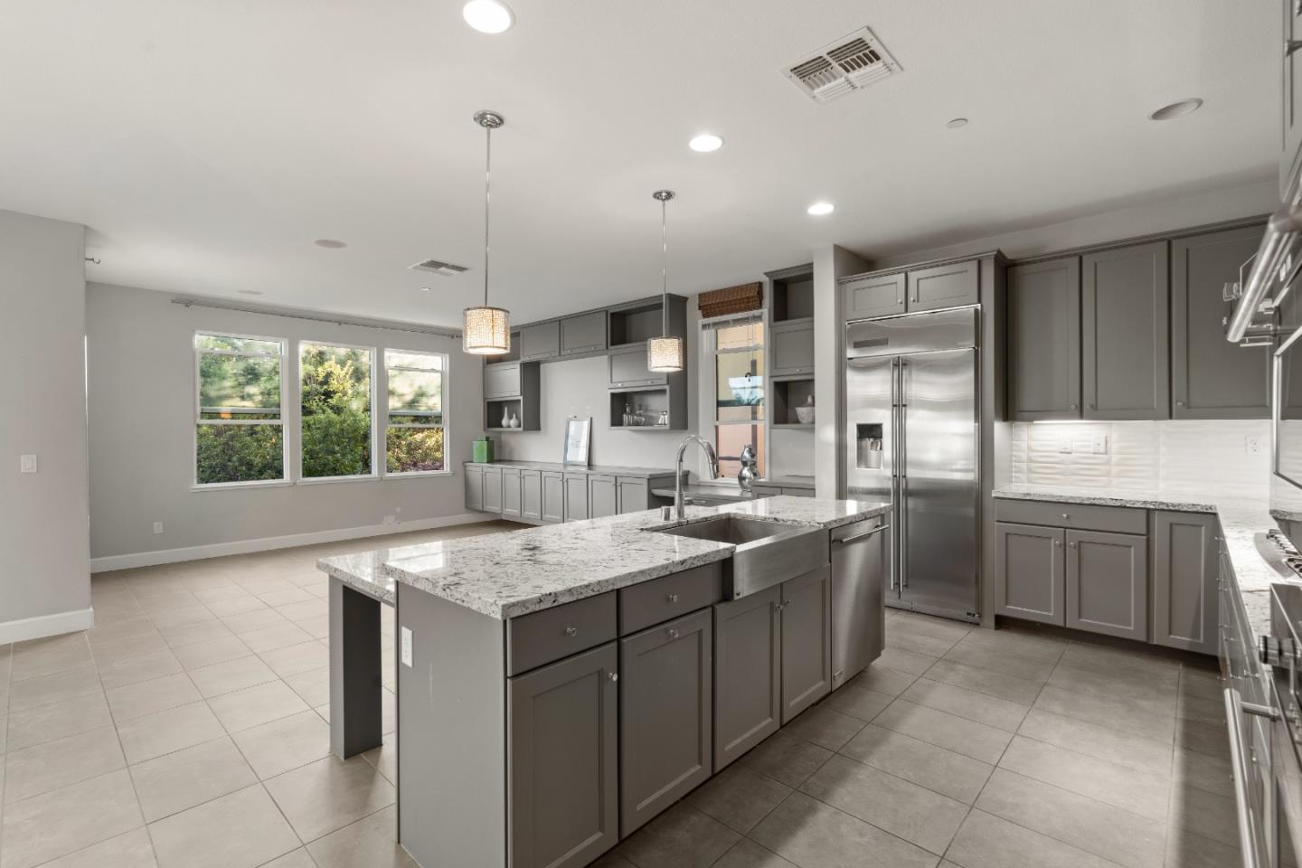 2006 Jubilee Drive Hayward, CA 94541 - Photo 10 of 73 a large kitchen with kitchen island a large counter space a sink appliances and cabinets