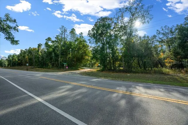 a view of a house with a big yard