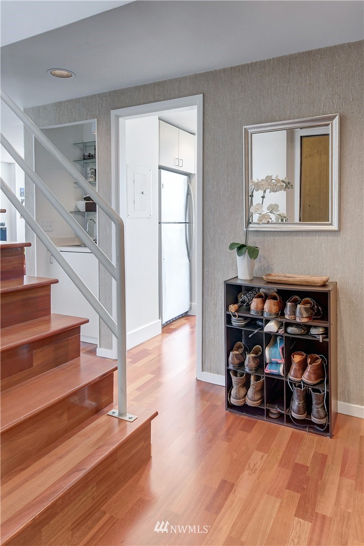 2125 1st Avenue, Unit 1702 Seattle, WA 98121 - Photo 2 of 31 a view of livingroom with furniture and wooden floor