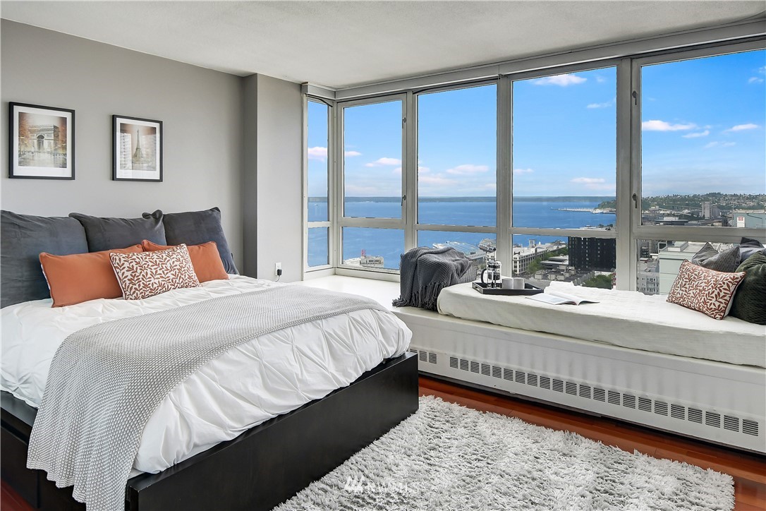 2125 1st Avenue, Unit 1702 Seattle, WA 98121 - Photo 12 of 31 a bedroom with bed and a large window