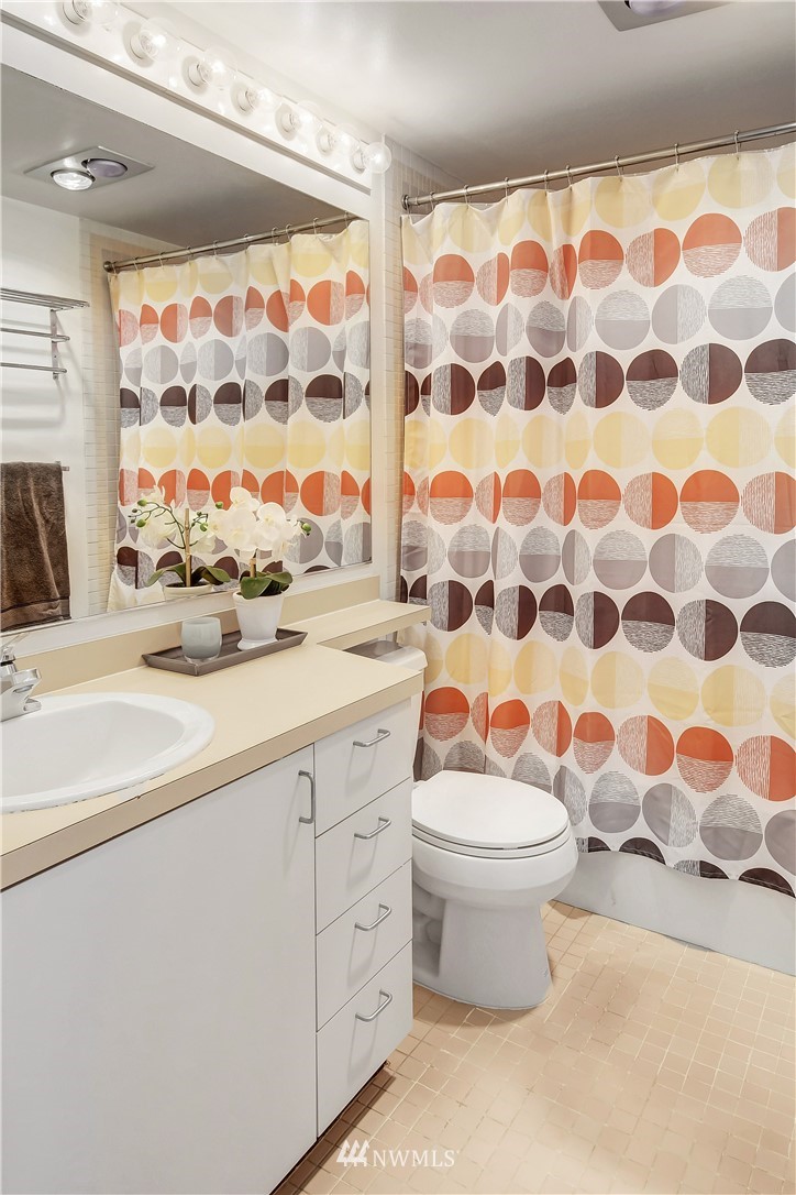 2125 1st Avenue, Unit 1702 Seattle, WA 98121 - Photo 17 of 31 a bathroom with a sink and a toilet