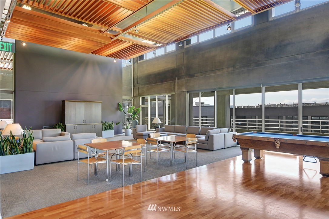 2125 1st Avenue, Unit 1702 Seattle, WA 98121 - Photo 20 of 31 a living room with furniture and a large window