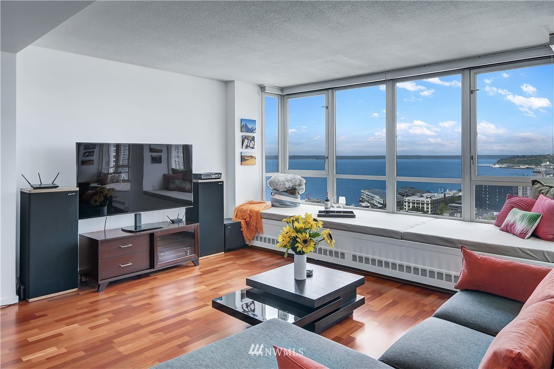 2125 1st Avenue, Unit 1702 Seattle, WA 98121 - Photo 3 of 31 a living room with furniture kitchen view and large windows