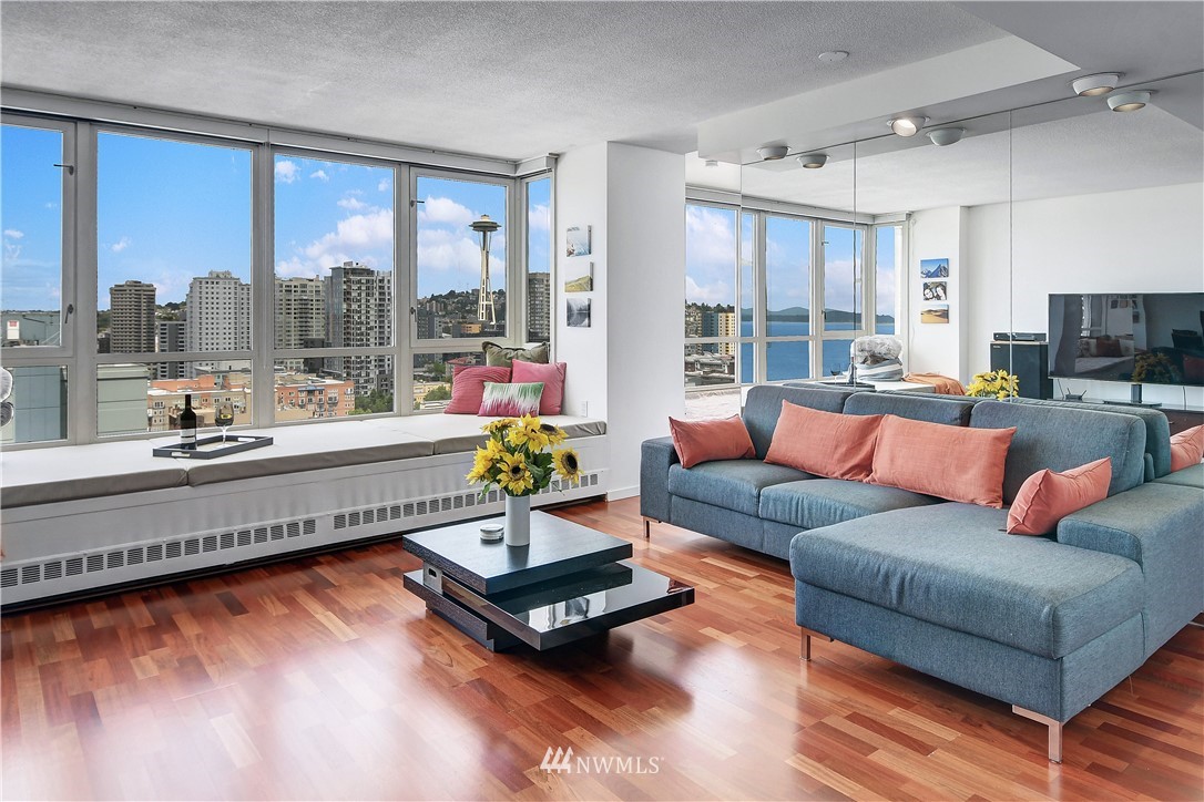 2125 1st Avenue, Unit 1702 Seattle, WA 98121 - Photo 4 of 31 a living room with furniture and a large window