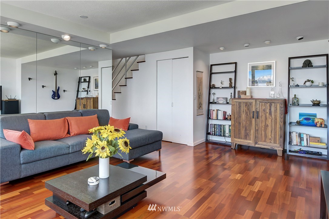 2125 1st Avenue, Unit 1702 Seattle, WA 98121 - Photo 5 of 31 a living room with furniture and wooden floor