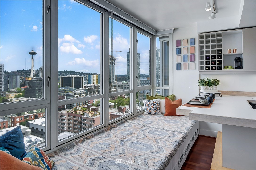 2125 1st Avenue, Unit 1702 Seattle, WA 98121 - Photo 6 of 31 a bedroom with furniture and large windows