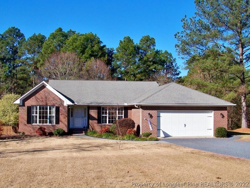 21 Princess Gate Whispering Pines, NC 28327 - Photo 1 of 33 a front view of a house with a garden