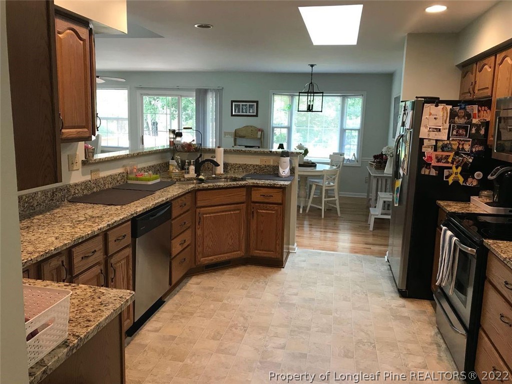 21 Princess Gate Whispering Pines, NC 28327 - Photo 11 of 33 a kitchen with lots of counter top space