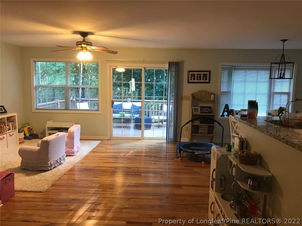 21 Princess Gate Whispering Pines, NC 28327 - Photo 16 of 33 a bed room with a bed and a large window