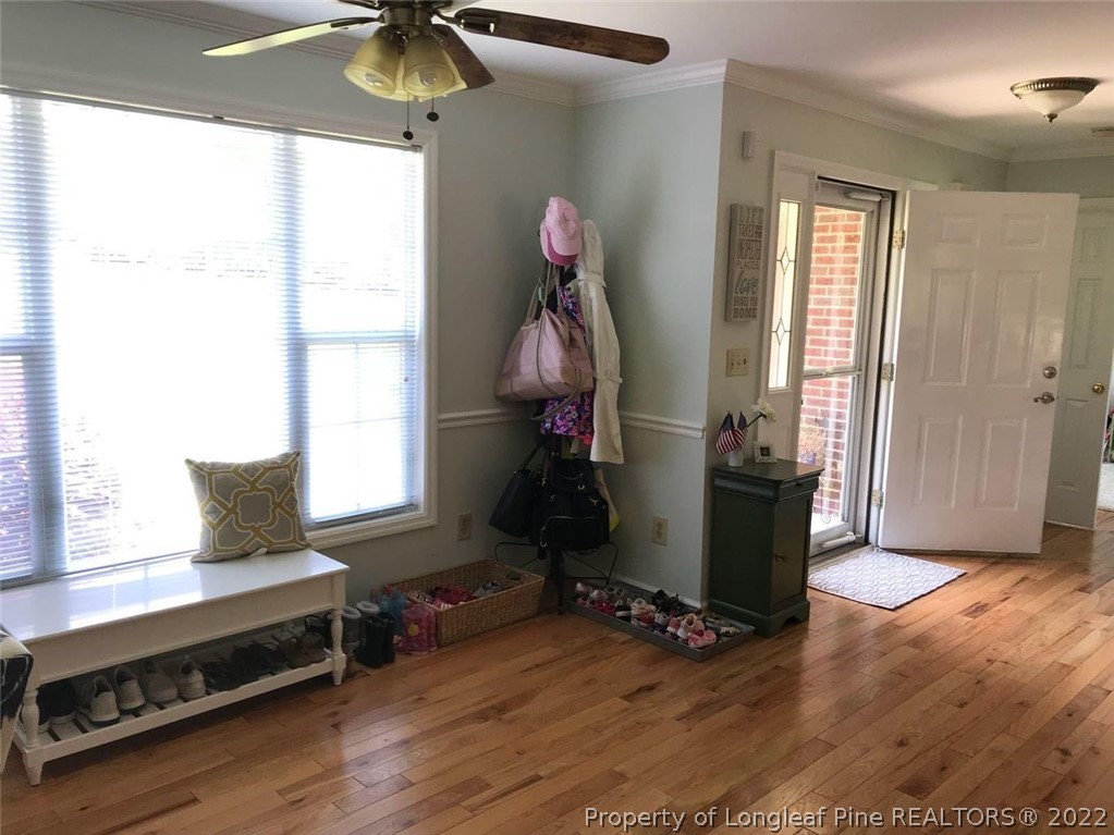 21 Princess Gate Whispering Pines, NC 28327 - Photo 2 of 33 a living room with hard wood floors and a window
