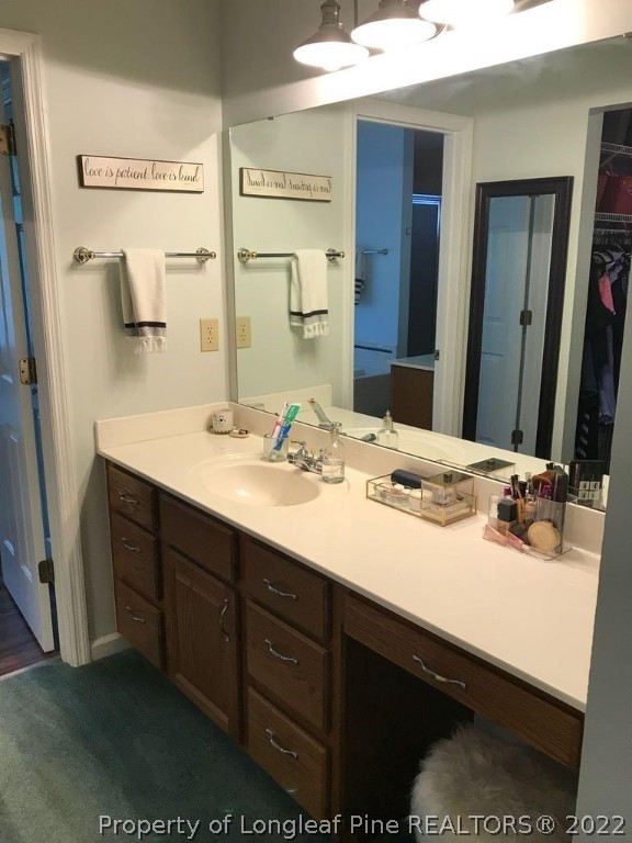 21 Princess Gate Whispering Pines, NC 28327 - Photo 21 of 33 a bathroom with a sink double vanity and a mirror