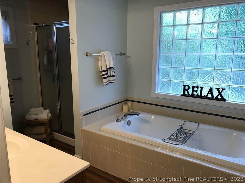 21 Princess Gate Whispering Pines, NC 28327 - Photo 22 of 33 a bath tub sitting next to a window