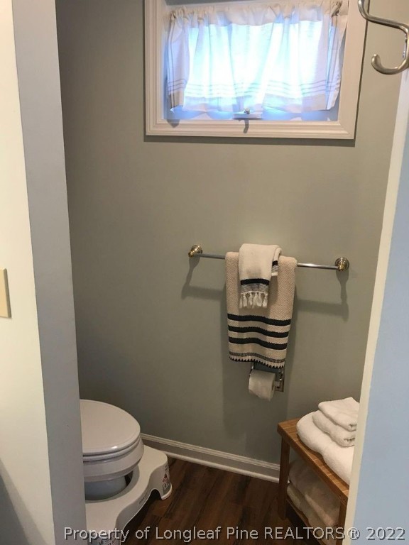 21 Princess Gate Whispering Pines, NC 28327 - Photo 23 of 33 a toilet sitting in a bathroom next to a window
