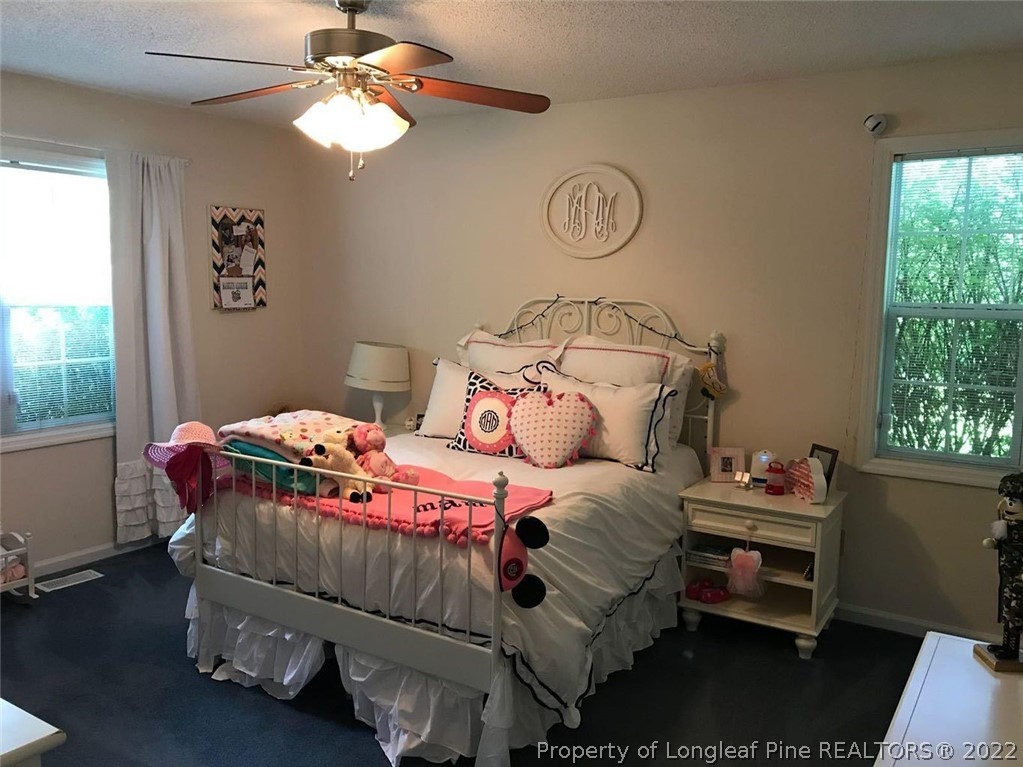 21 Princess Gate Whispering Pines, NC 28327 - Photo 28 of 33 a bedroom with a bed and a window