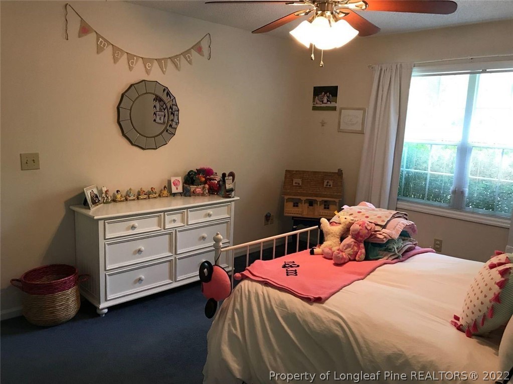 21 Princess Gate Whispering Pines, NC 28327 - Photo 29 of 33 a bedroom with a bed and a window