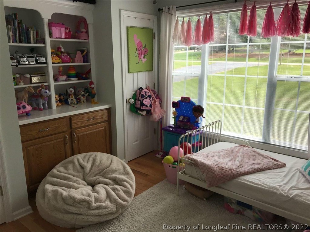 21 Princess Gate Whispering Pines, NC 28327 - Photo 33 of 33 a bedroom with a bed and a window