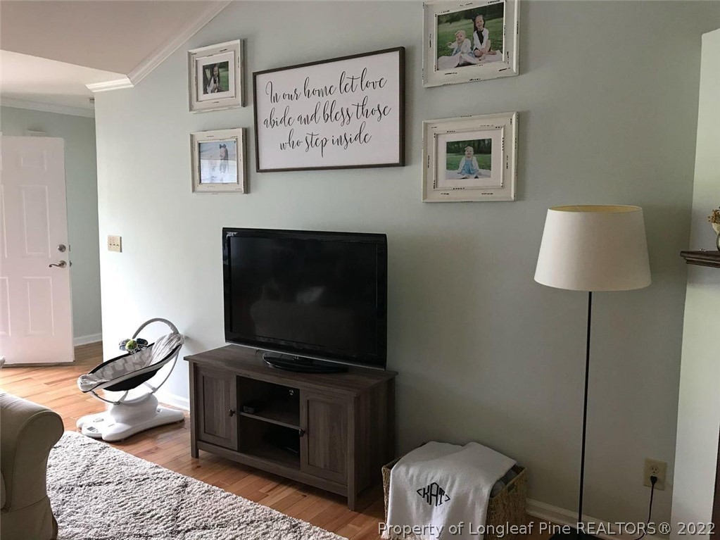 21 Princess Gate Whispering Pines, NC 28327 - Photo 5 of 33 a living room with furniture and a flat screen tv