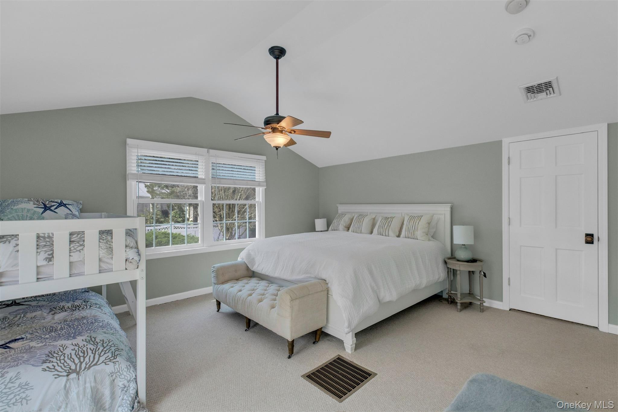 345 Colonial Road Southold, NY 11971 - Photo 25 of 43 a bed room with a bed and a window