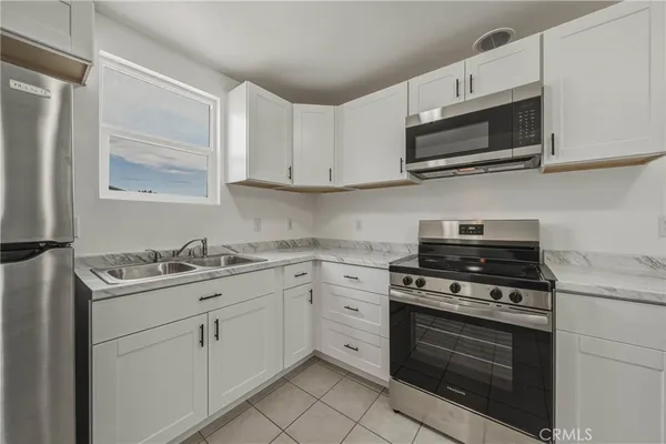 a view of an empty room and wooden floor