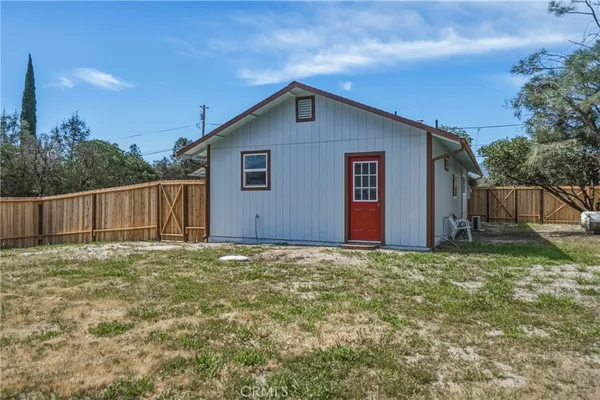 an aerial view of residential house with outdoor space