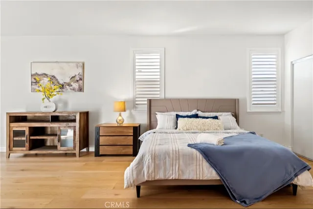 a bedroom with a bed and a couch