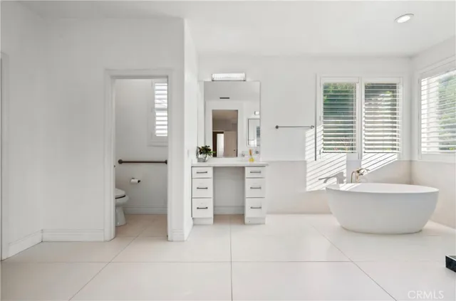a bathroom with a bathtub sink and toilet