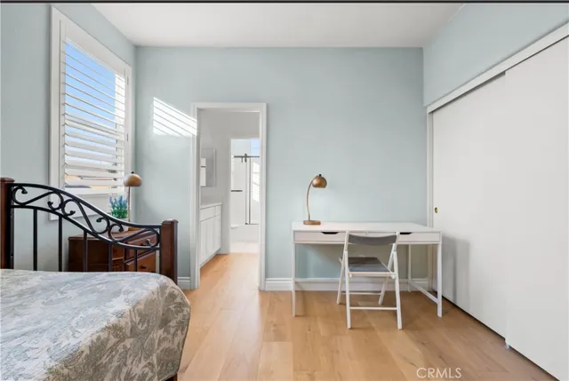 a bedroom with a bed and a table in it