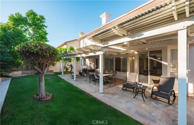 a view of a backyard with a patio