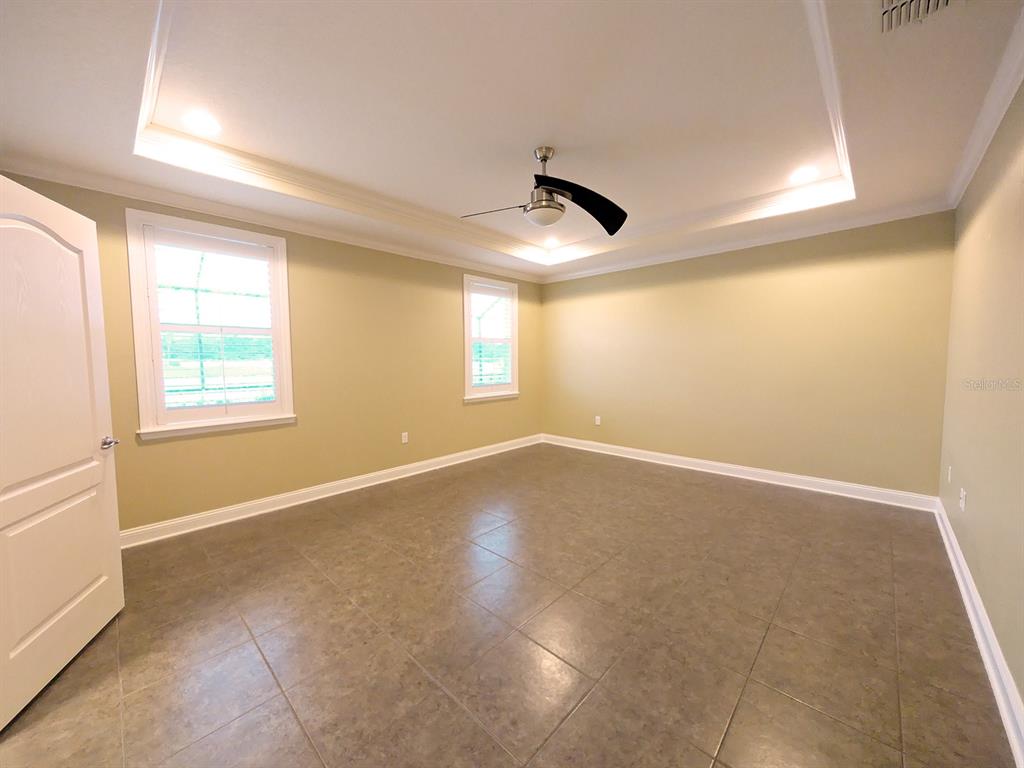 43 Turtle Ridge Drive Flagler Beach, FL 32136 - Photo 27 of 61 Master bedroom overlooking outdoor oasis and lake