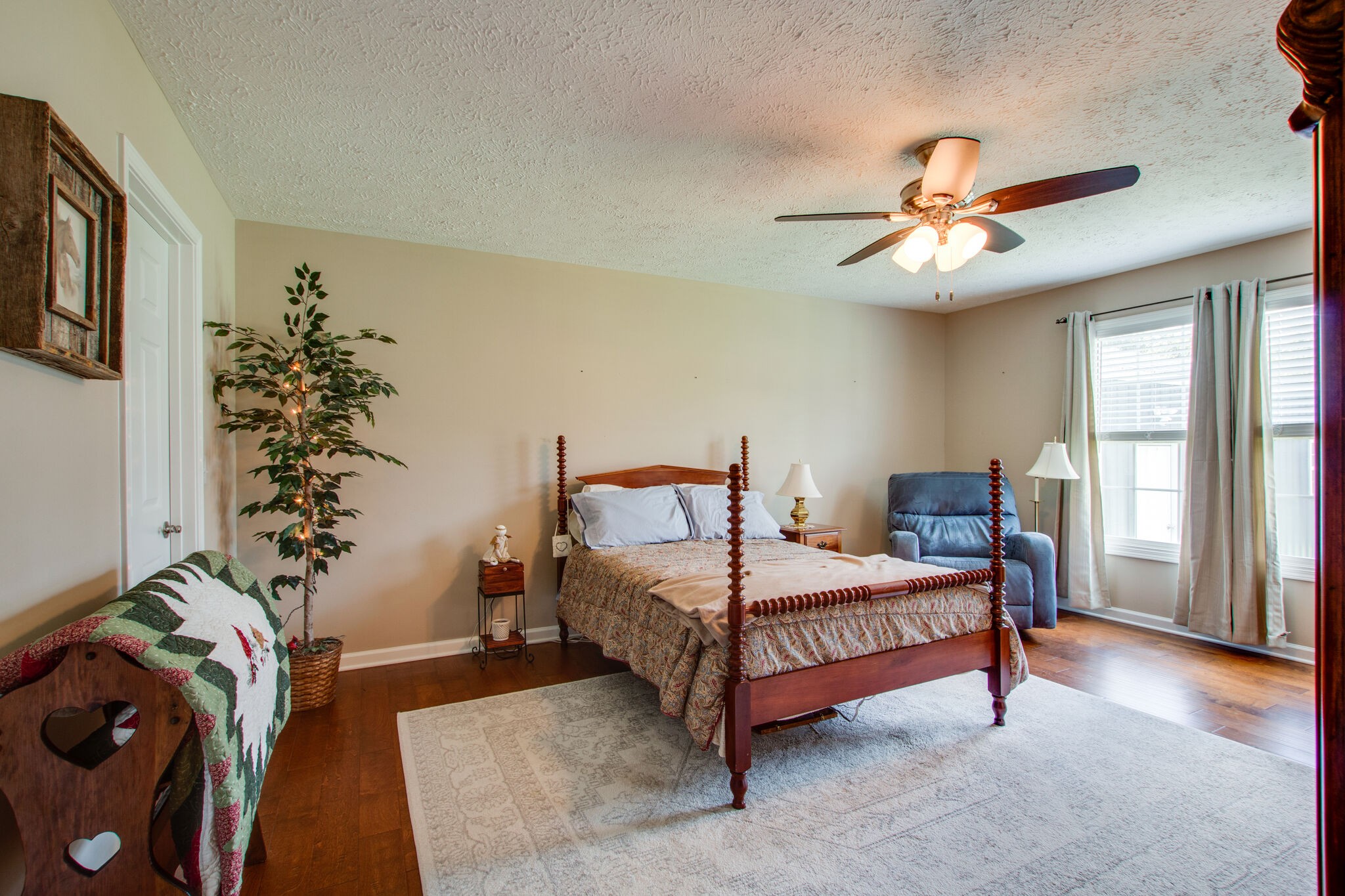 84 Houston Bell Road Manchester, TN 37355 - Photo 15 of 36 a bedroom with a bed and a chandelier